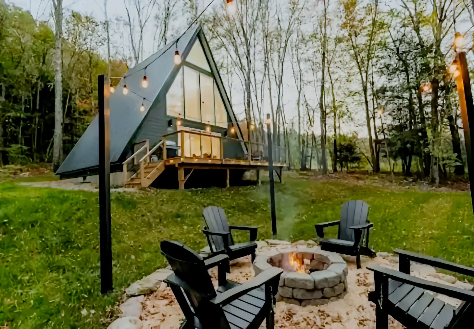 Polywood chairs by a fire pit at a contemporary cabin.