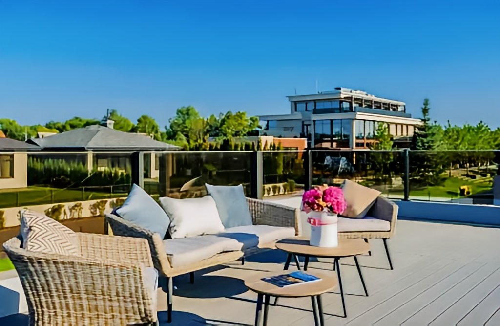 Polywood furniture on a modern rooftop deck.